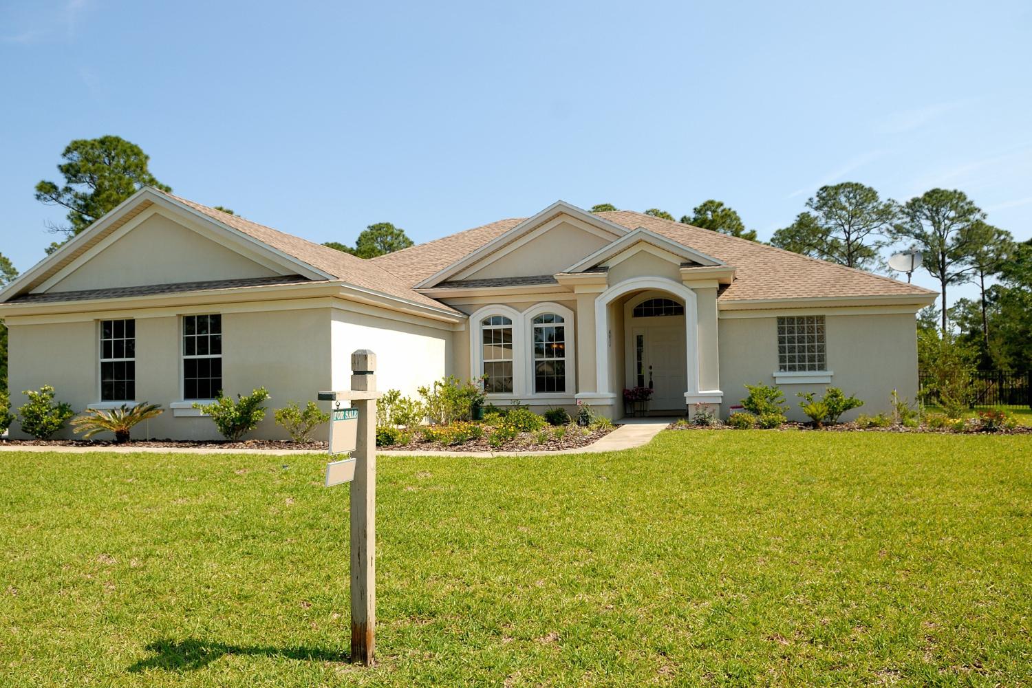 front view of a house with a lawn