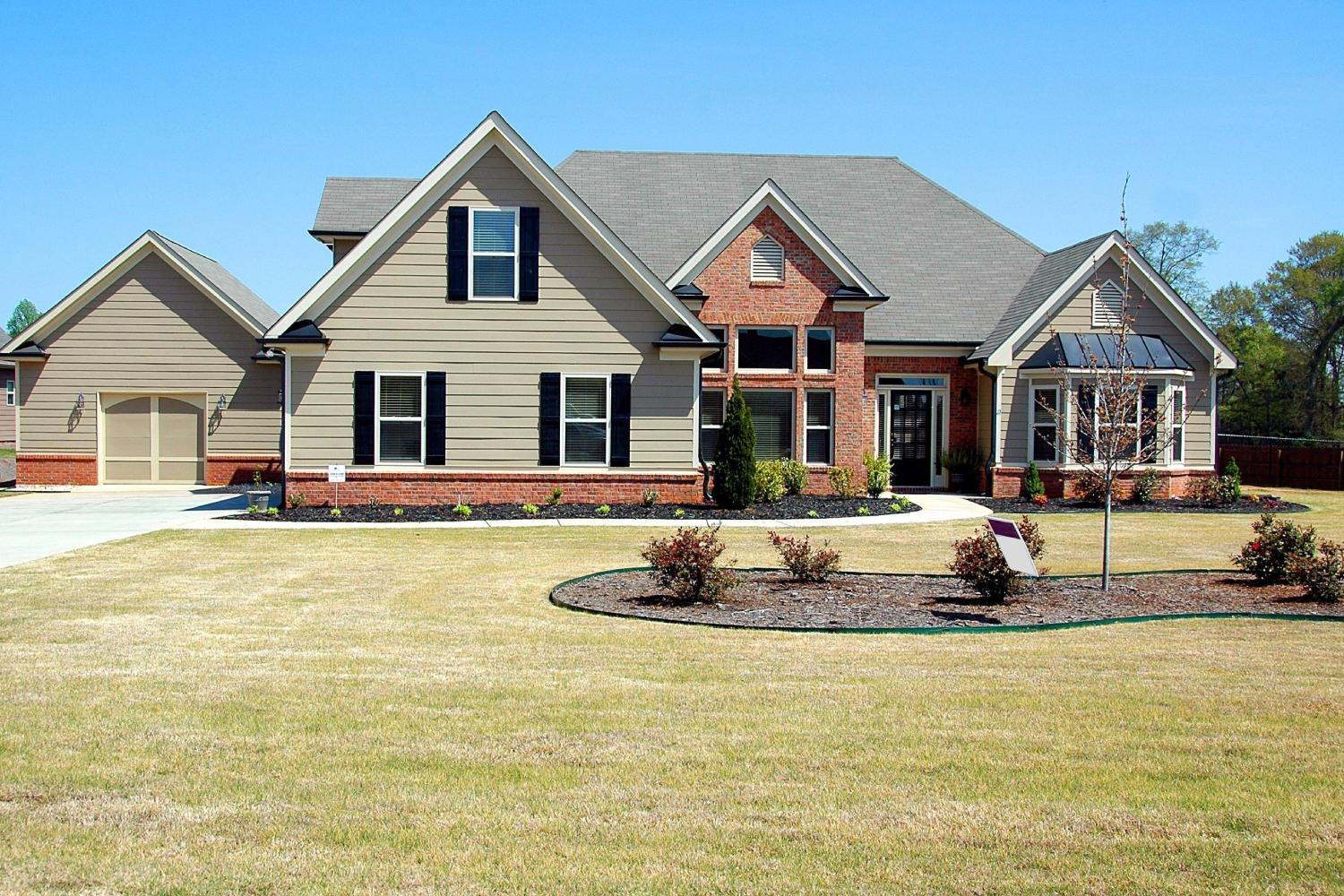 front view of a spacious house with garden